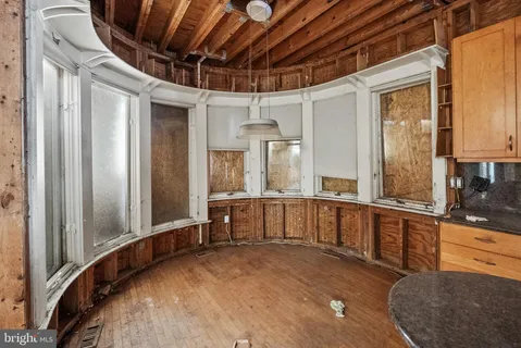 a view of a kitchen with a sink and cabinets