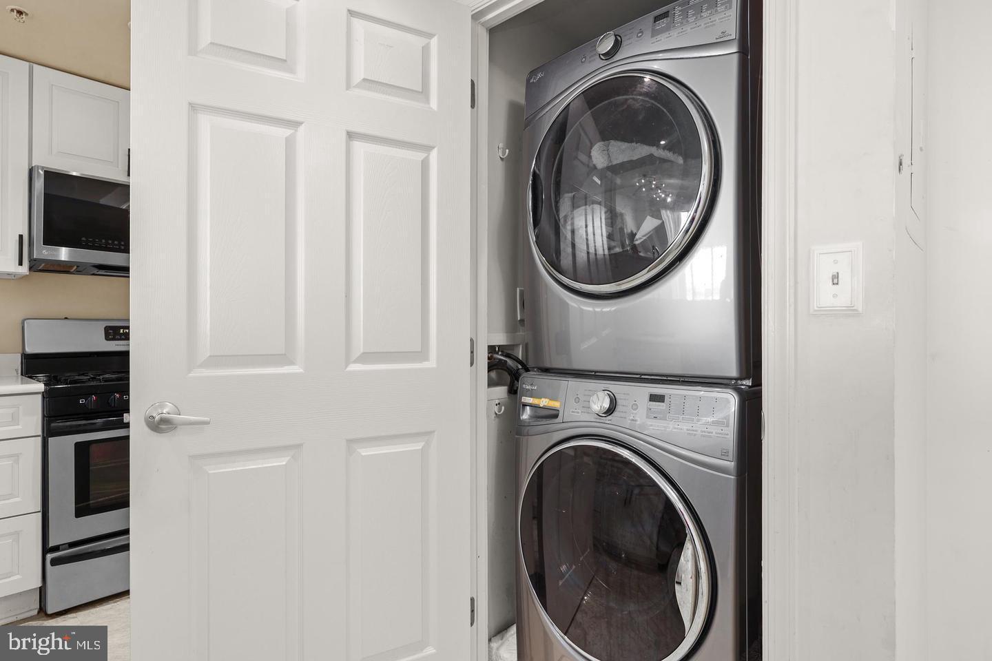 2726 Gallows Road, Unit 1004 Vienna, VA 22180 - Photo 8 of 17 a view of a hallway with washer and dryer