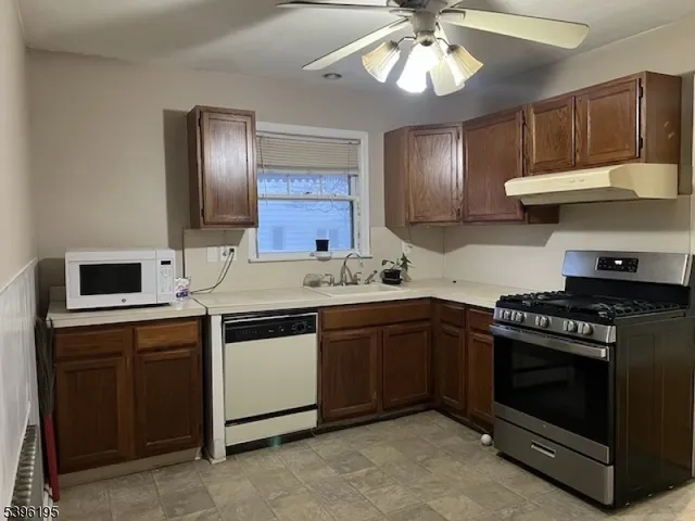 a white refrigerator freezer sitting in a kitchen