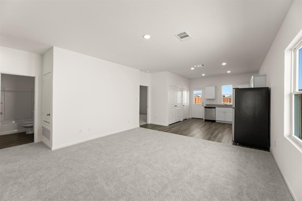 501 Merced River Lane Anna, TX 75409 - Photo 7 of 28 a view of empty room with wooden floor