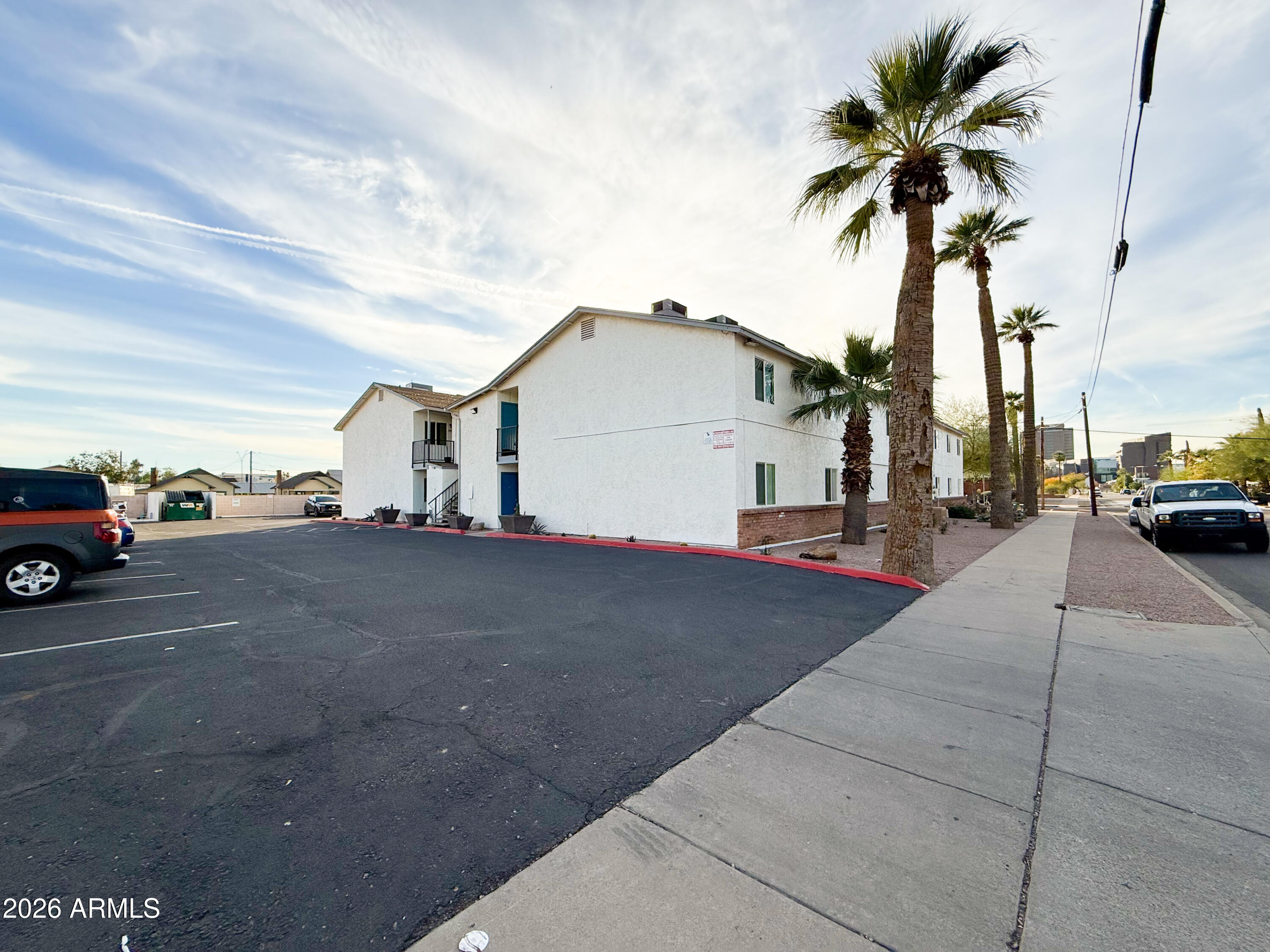 349 North 11th Street, Unit 207 Phoenix, AZ 85006 - Photo 3 of 20 a view of a car parked in front of a house