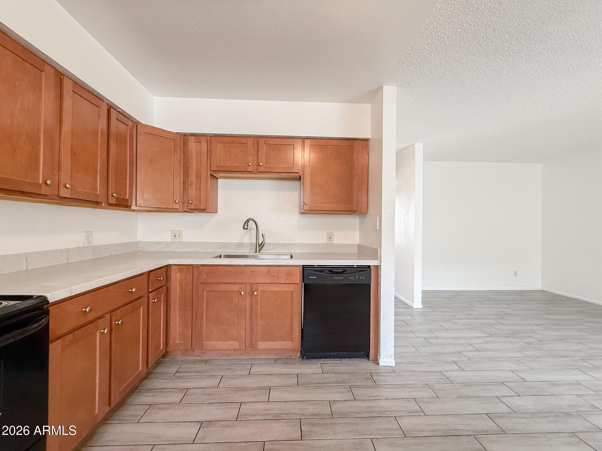 349 North 11th Street, Unit 207 Phoenix, AZ 85006 - Photo 7 of 20 a kitchen with stainless steel appliances granite countertop a sink and a stove