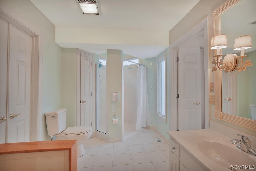 3906 Timber Ridge Road Midlothian, VA 23112 - Photo 9 of 15 a bathroom with a double vanity sink mirror and shower