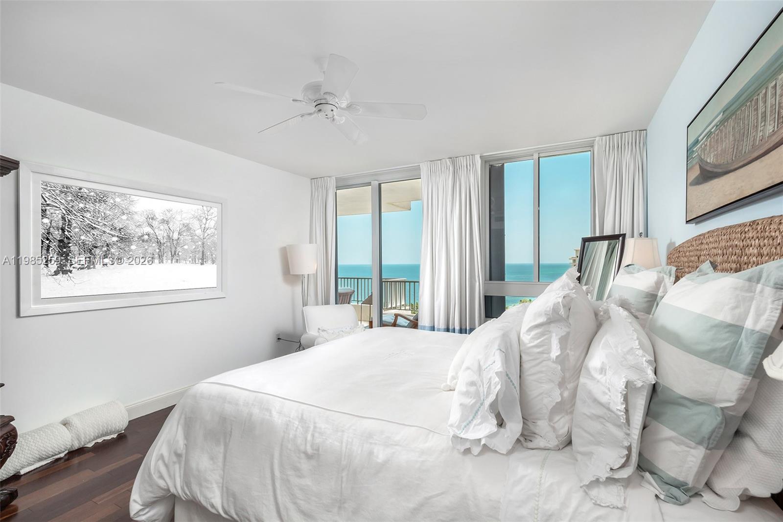 781 Crandon Boulevard, Unit 1603 Key Biscayne, FL 33149 - Photo 11 of 34 a bedroom with a bed and a large window