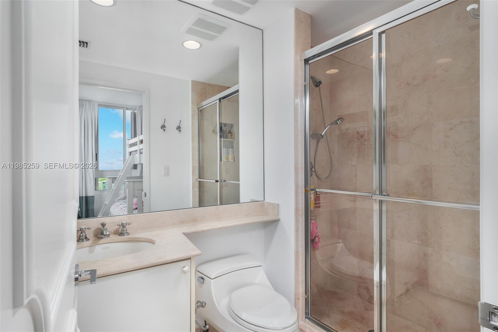 781 Crandon Boulevard, Unit 1603 Key Biscayne, FL 33149 - Photo 16 of 34 a bathroom with a sink toilet and shower
