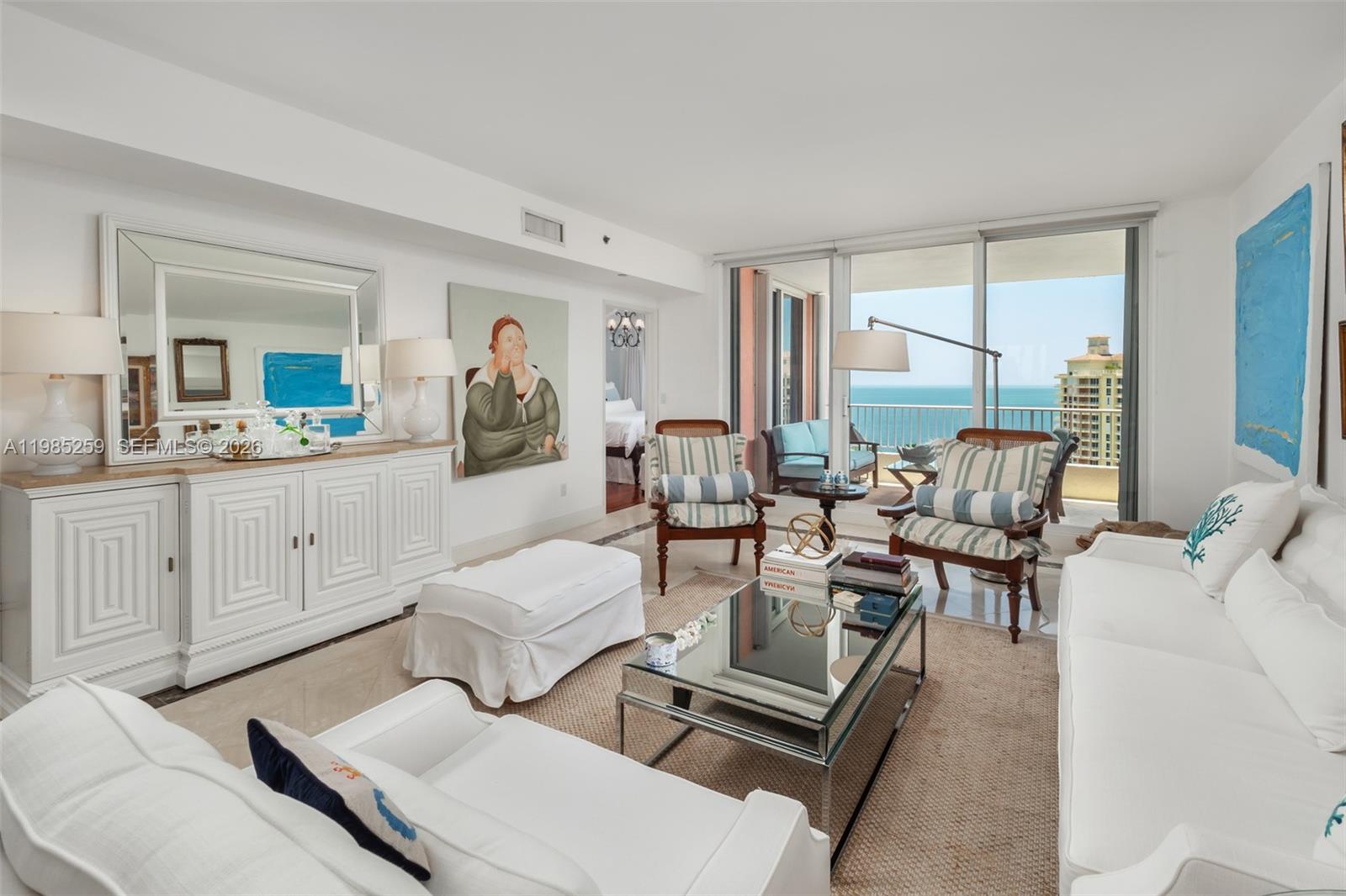 781 Crandon Boulevard, Unit 1603 Key Biscayne, FL 33149 - Photo 2 of 34 a living room with furniture and a large window