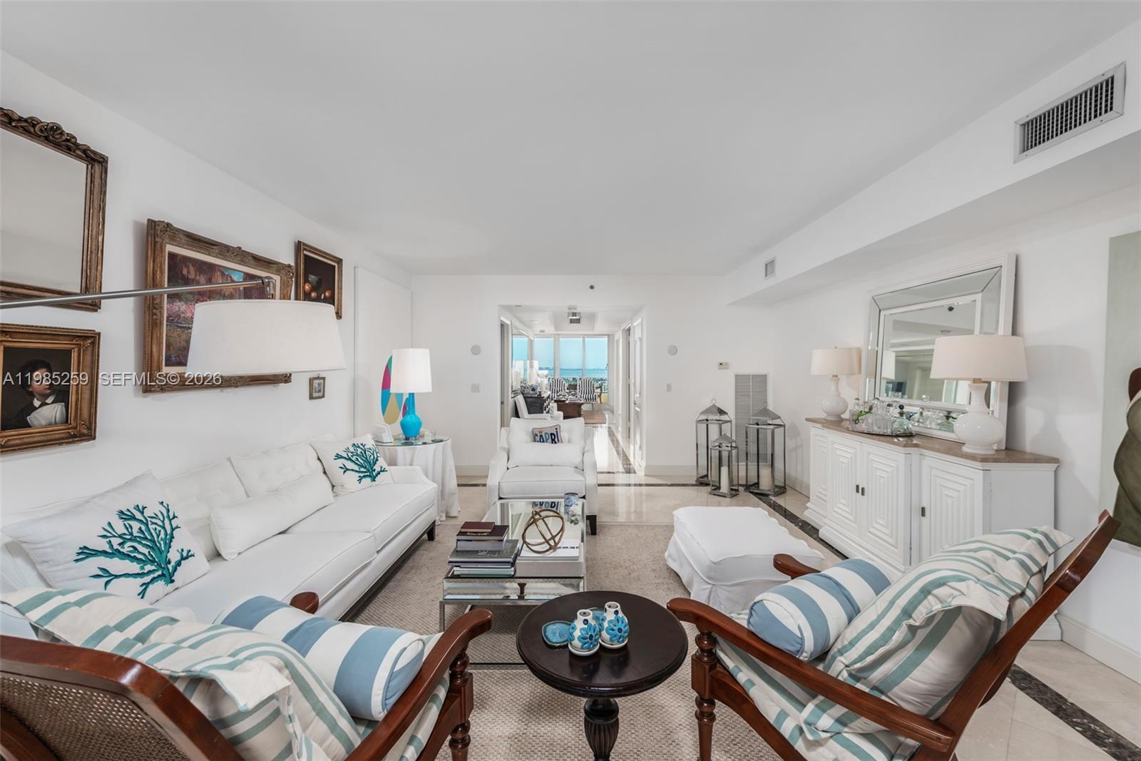 781 Crandon Boulevard, Unit 1603 Key Biscayne, FL 33149 - Photo 3 of 34 a living room with furniture and wooden floor