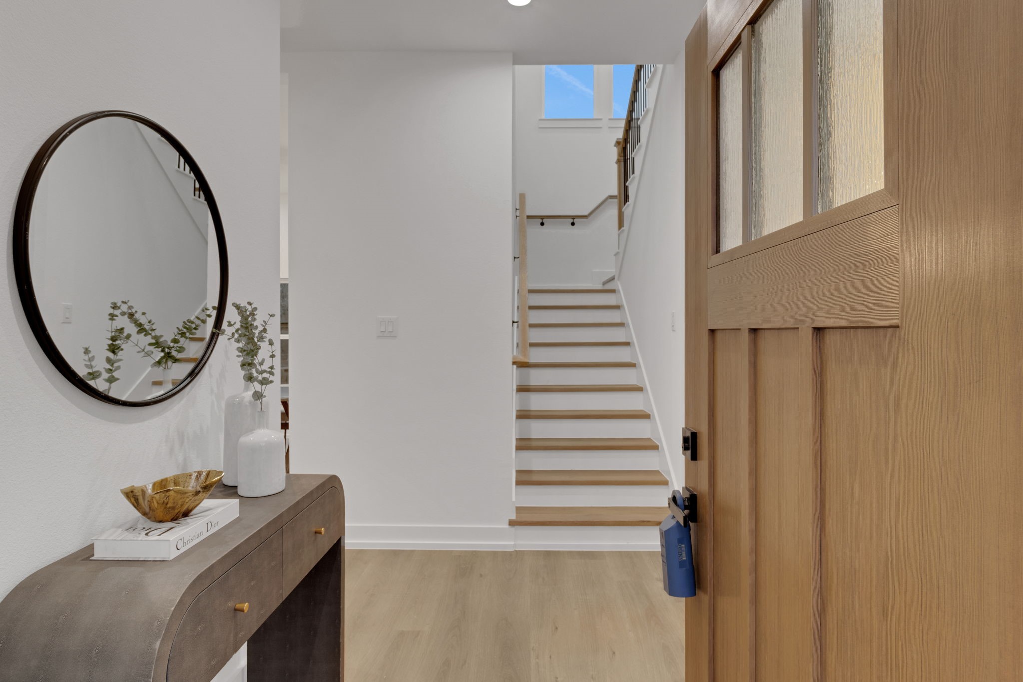 4202 Plaag Street Houston, TX 77016 - Photo 6 of 38 Welcoming foyer with natural wood accents and open staircase leading to the second level.