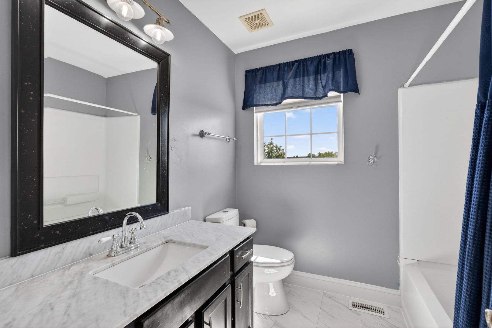 25204 Spring Street Manhattan, IL 60442 - Photo 14 of 34 a bathroom with a sink a toilet and mirror