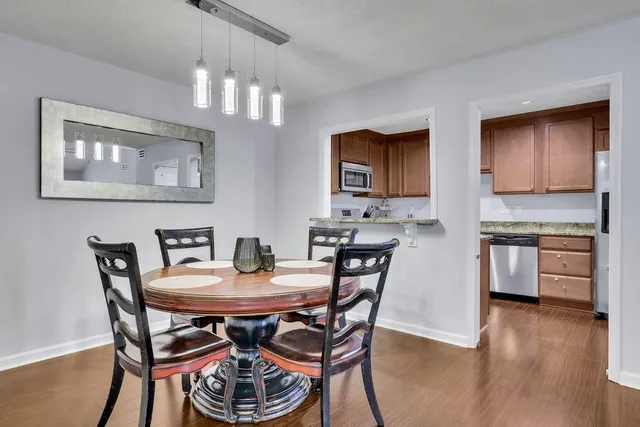 a dining room with furniture and window