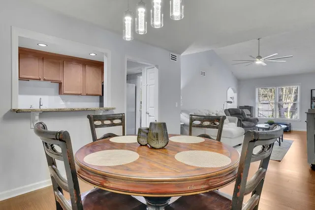 a view of a dining room with furniture and wooden floor
