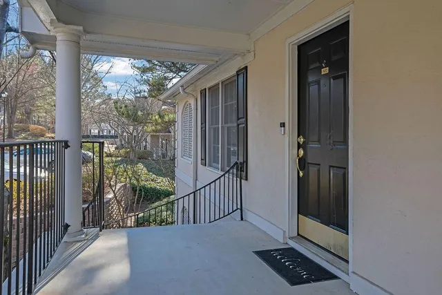 a living room with furniture fireplace and a flat screen tv