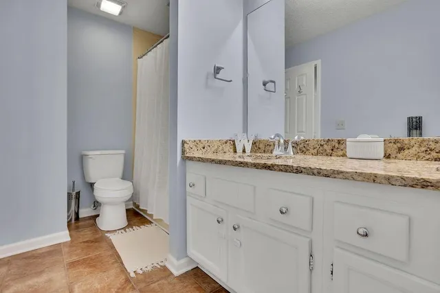 a living room with furniture and a gate