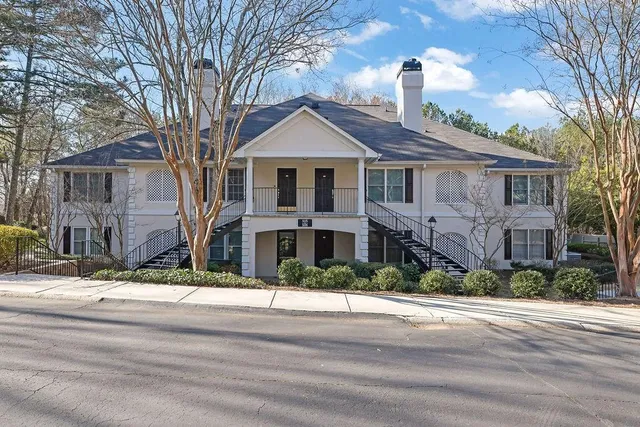 a view of a house with a backyard porch and sitting area