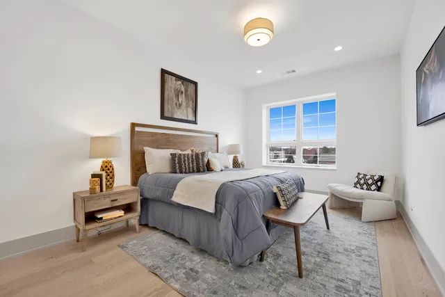 a bedroom with a bed and a couch