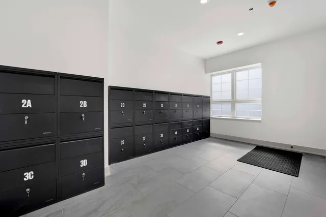 a room with a dresser and a window