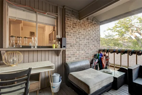 a view of a balcony and chairs