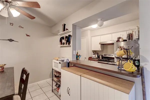 a kitchen with a sink appliances and cabinets