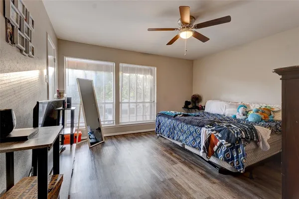 a bed room with a bed and a chandelier