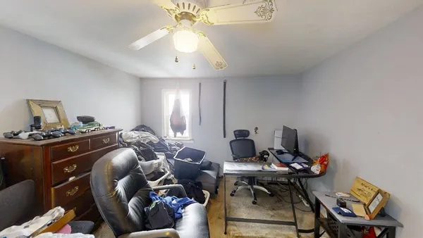 a bedroom with furniture and a window