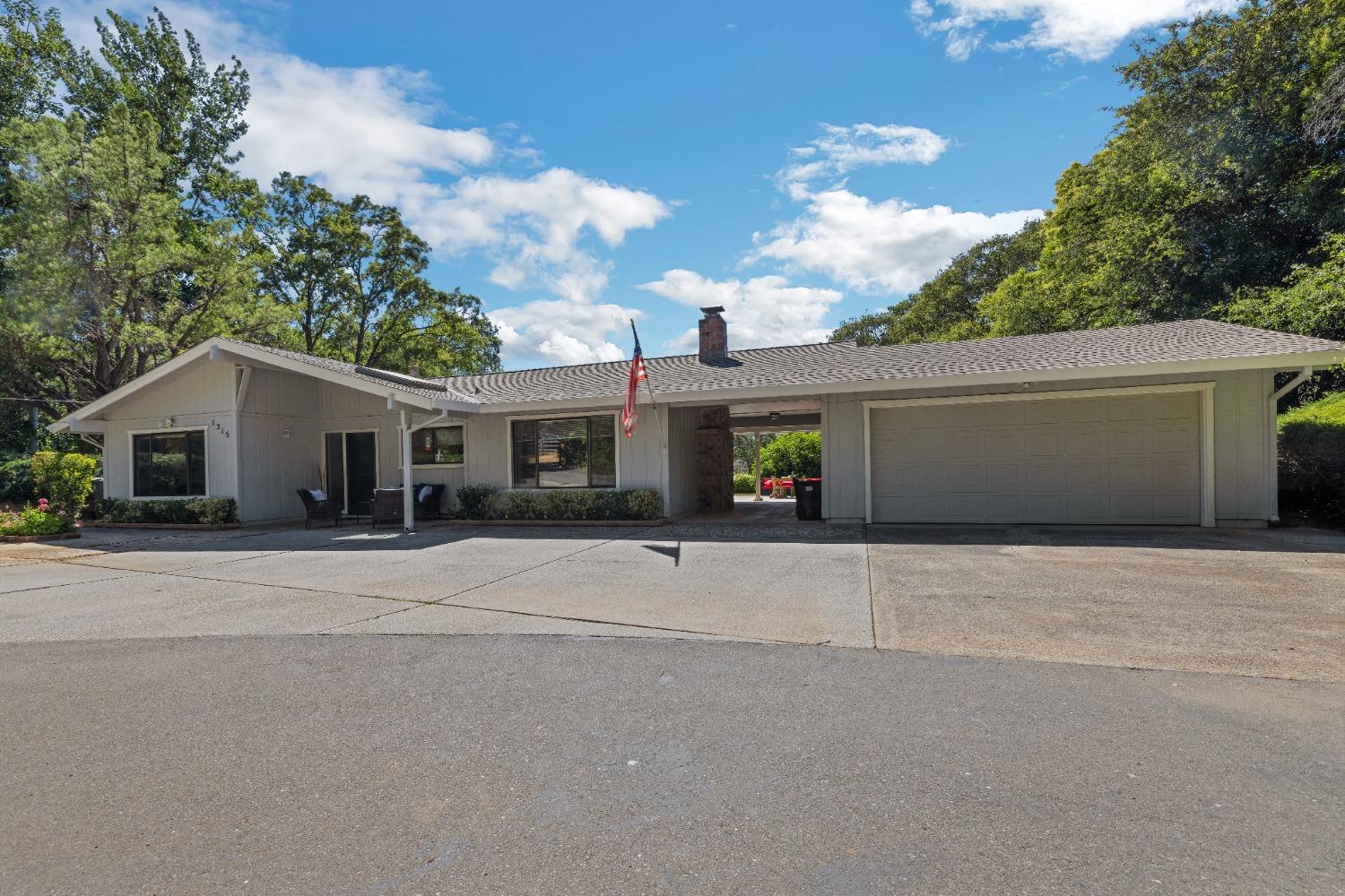 1315 Matson Drive Auburn, CA 95603 - Photo 1 of 1 a front view of a house with a yard and garage