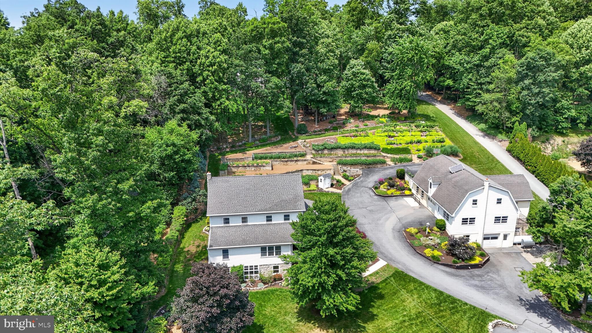 257 Hill Road New Holland, PA 17557 - Photo 9 of 94 Serene retreat amidst lush greenery.