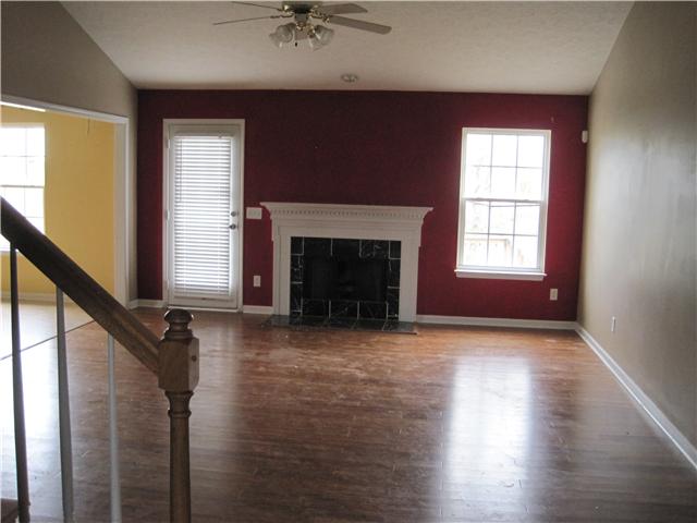 1954 Portway Road Spring Hill, TN 37174 - Photo 3 of 16 Greatroom looking ahead fromt fhe front door shows fireplace with white mantle.