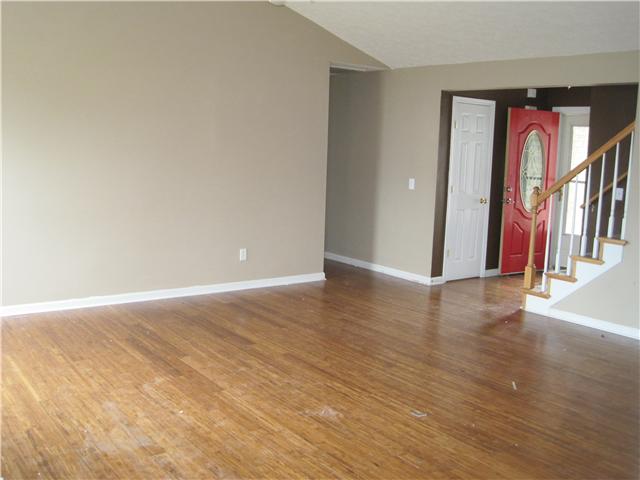 1954 Portway Road Spring Hill, TN 37174 - Photo 4 of 16 Spacious Greatroom with laminate flooring, and stairs leading up the massive Bonus room with full bath.