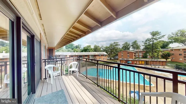 a view of staircase with white walls and a window