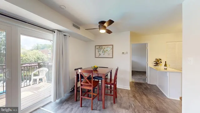 a view of a dining room with furniture and wooden floor