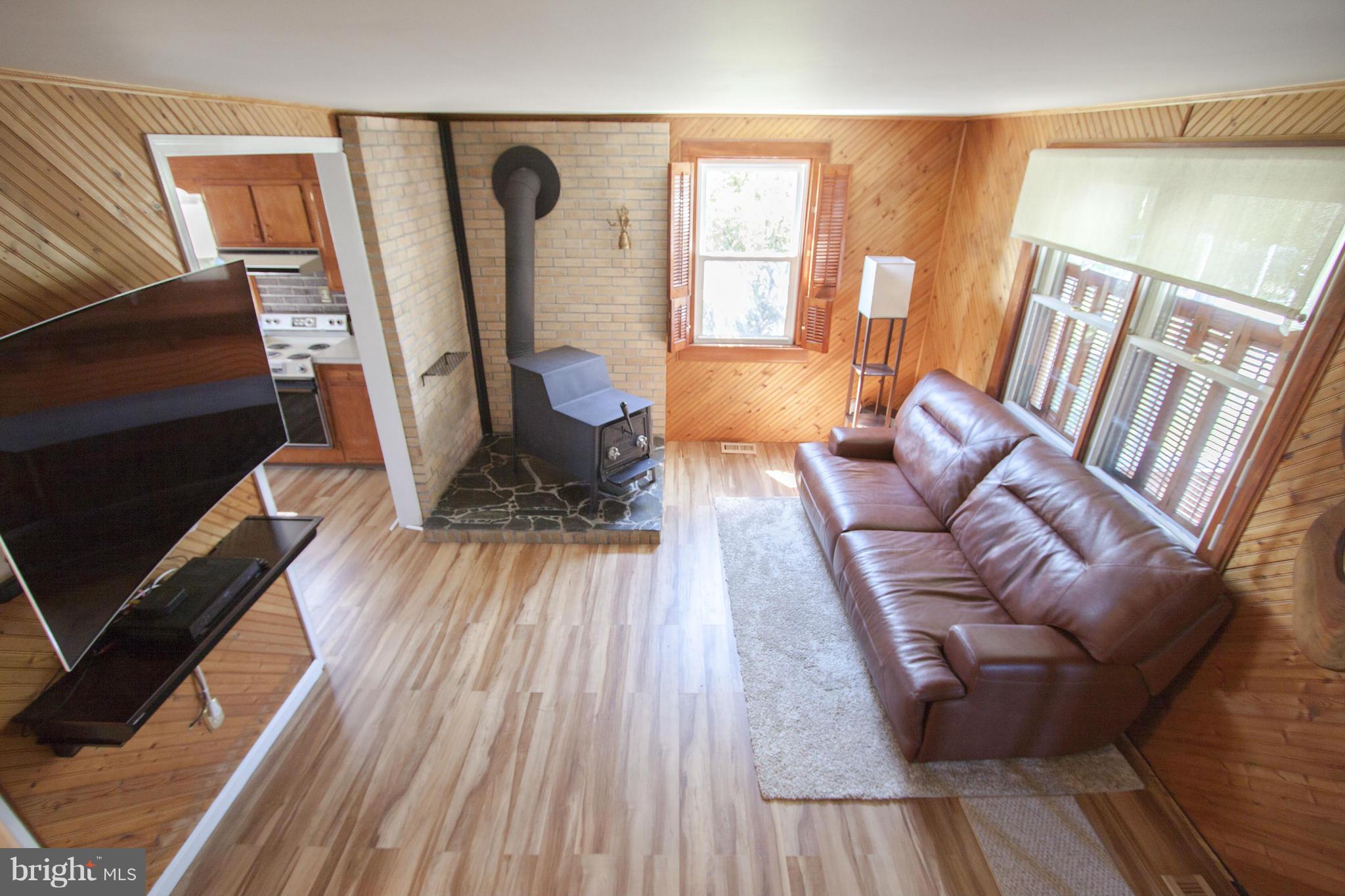 1402 Clearview Road Edgewood, MD 21040 - Photo 13 of 30 a living room with furniture and a fireplace