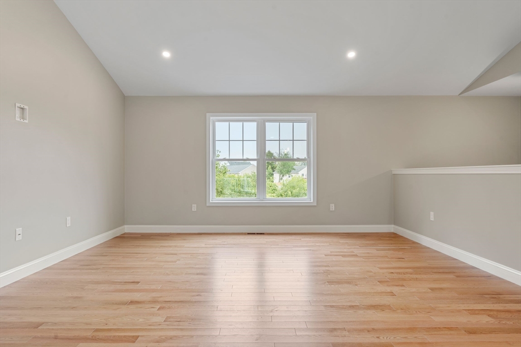 20 Bronson Street Fall River, MA 02721 - Photo 16 of 16 wooden floor in an empty room with a window