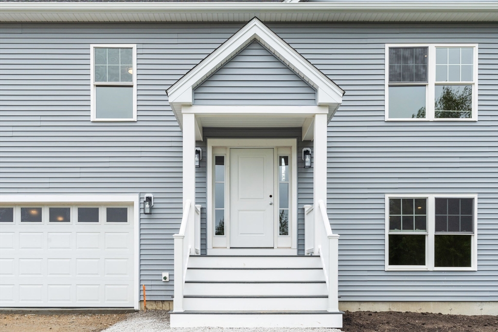 20 Bronson Street Fall River, MA 02721 - Photo 3 of 16 a view of a house with white door and a window