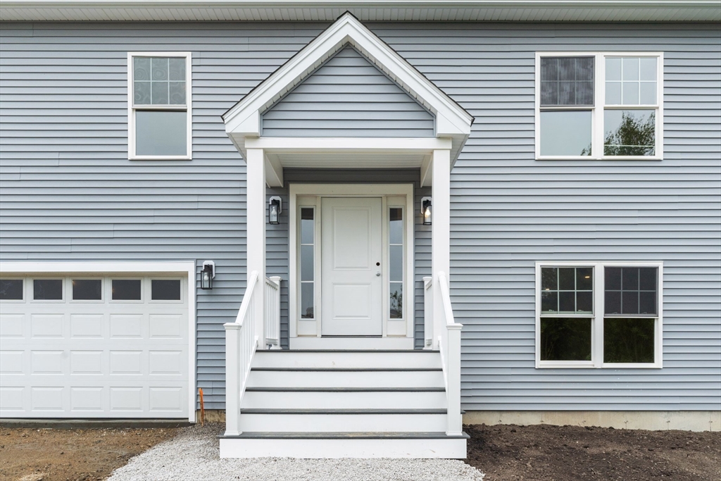 20 Bronson Street Fall River, MA 02721 - Photo 5 of 16 a view of a house with white door and a window