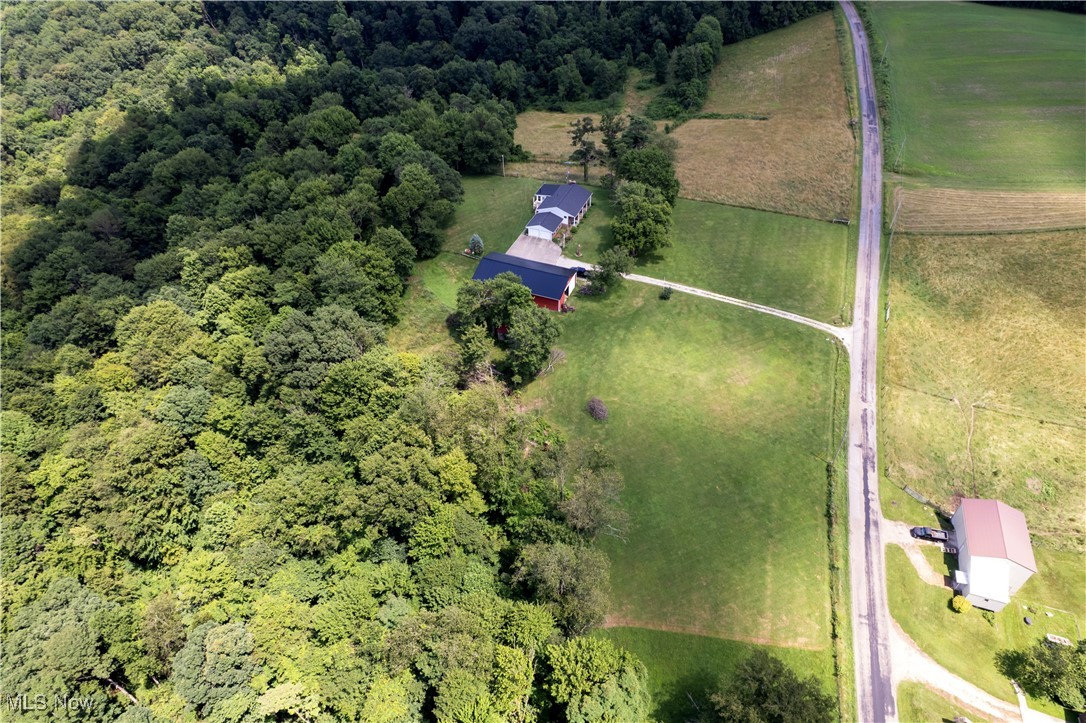 1292 Cinder Road Southeast Carrollton, OH 44615 - Photo 7 of 42 Aerial overview of property's location with rural landscape and a heavily wooded area