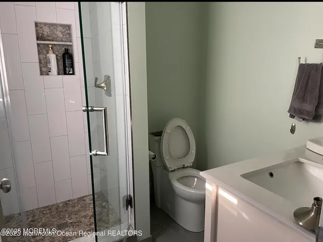 a bathroom with a toilet and a sink