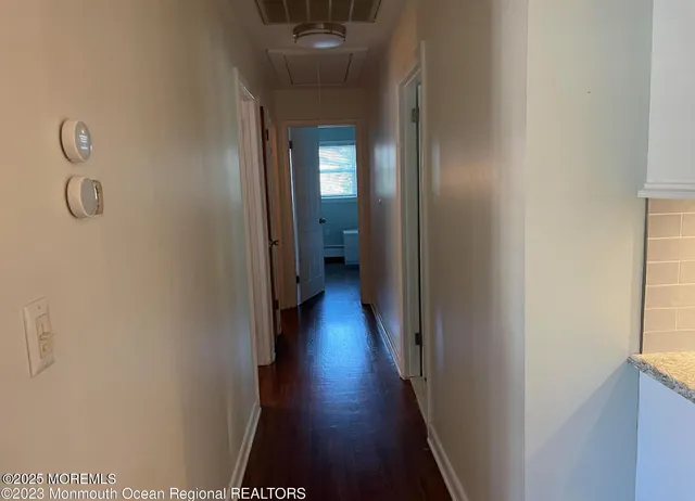 a view of a park with large trees