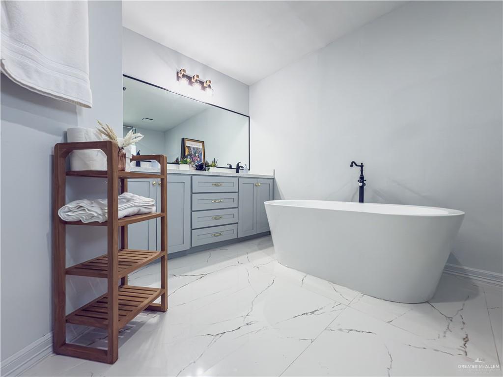 801 Ray Street Donna, TX 78537 - Photo 15 of 27 a white bath tub sitting in a bathroom