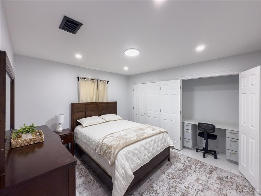 801 Ray Street Donna, TX 78537 - Photo 16 of 27 a bedroom with a bed and a chair