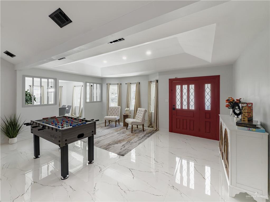 801 Ray Street Donna, TX 78537 - Photo 2 of 27 a living room with furniture a piano and a window