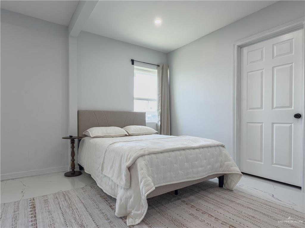 801 Ray Street Donna, TX 78537 - Photo 22 of 27 a bedroom with a bed and a window