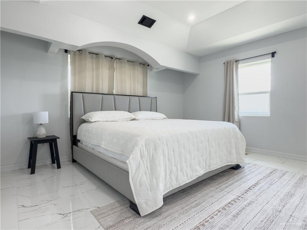 801 Ray Street Donna, TX 78537 - Photo 23 of 27 a bedroom with a bed and a window