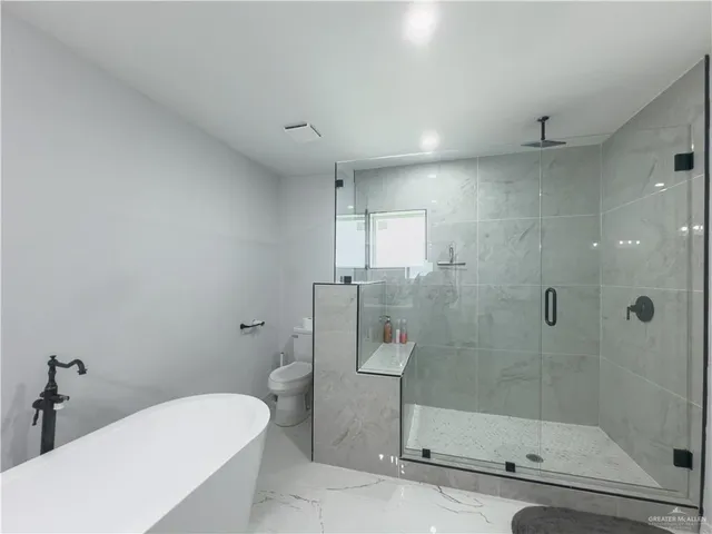 a room with a desk and workspace