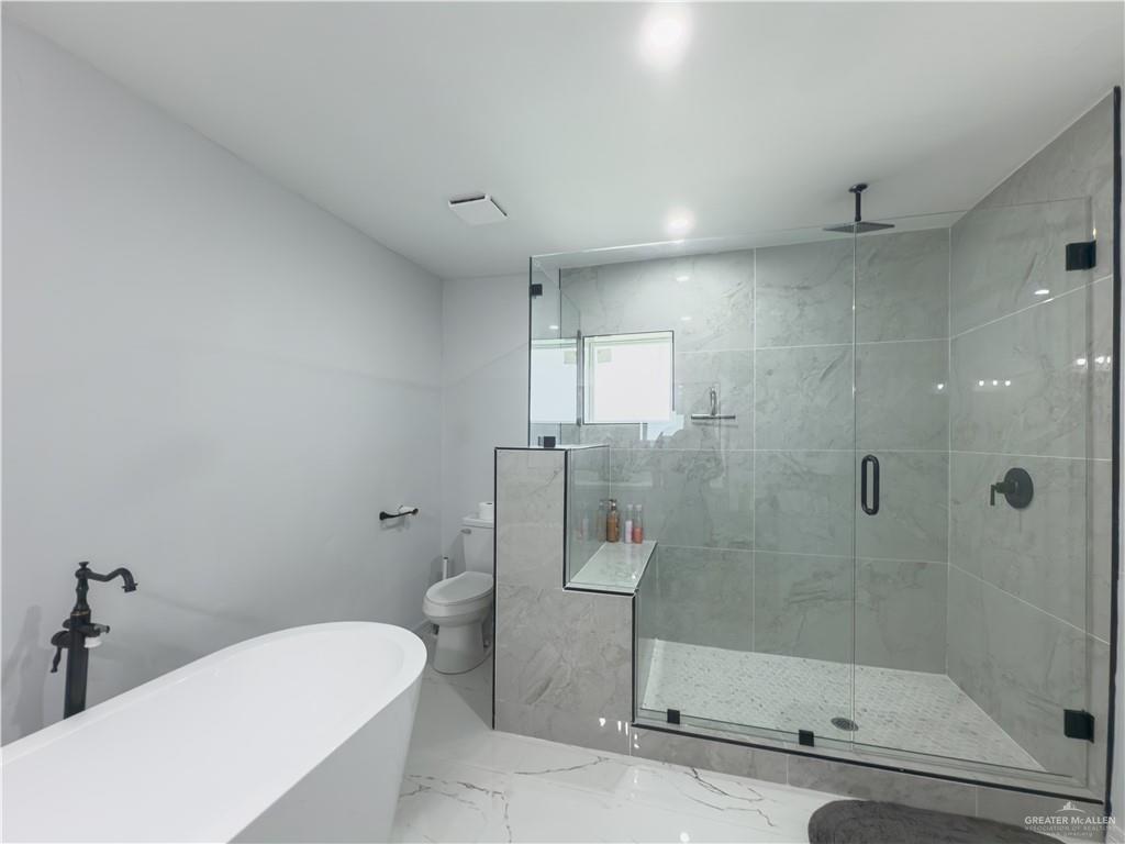 801 Ray Street Donna, TX 78537 - Photo 24 of 27 a bathroom with a shower and toilet