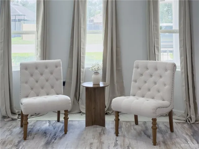 a living room with furniture and a window