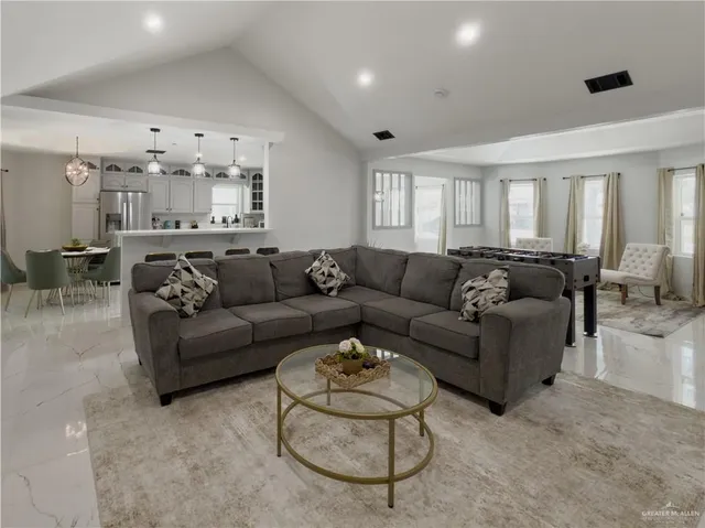 a living room with furniture and a large window