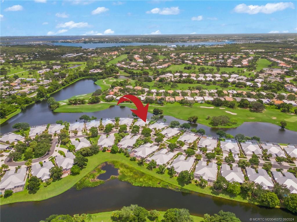 1663 Southwest Springfield Court Palm City, FL 34990 - Photo 1 of 27 an aerial view of residential houses with outdoor space