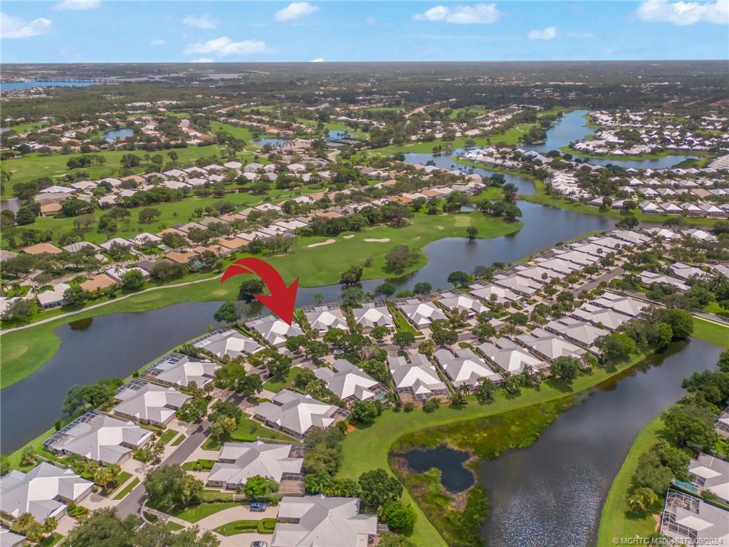 1663 Southwest Springfield Court Palm City, FL 34990 - Photo 2 of 27 an aerial view of residential houses with outdoor space