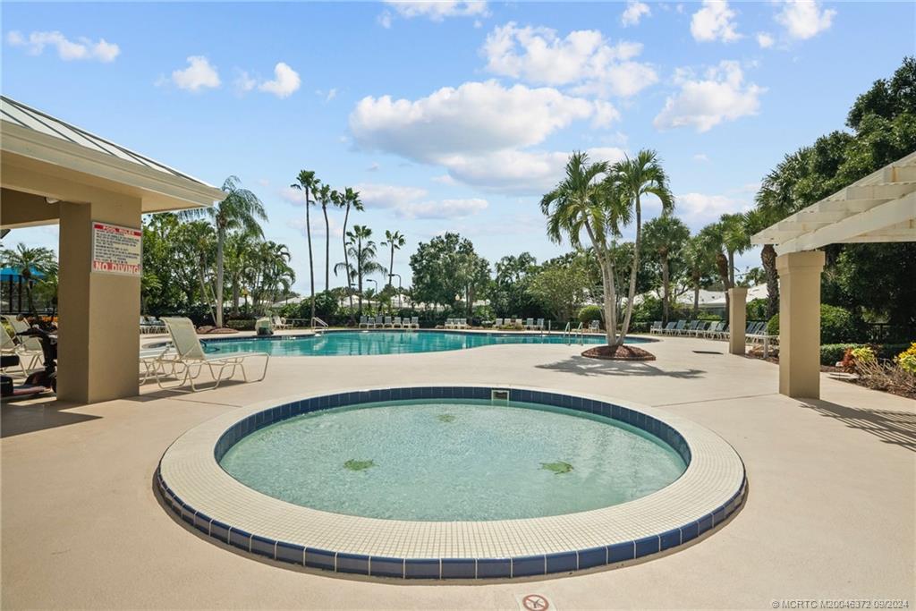 1663 Southwest Springfield Court Palm City, FL 34990 - Photo 25 of 27 a view of outdoor space and swimming pool