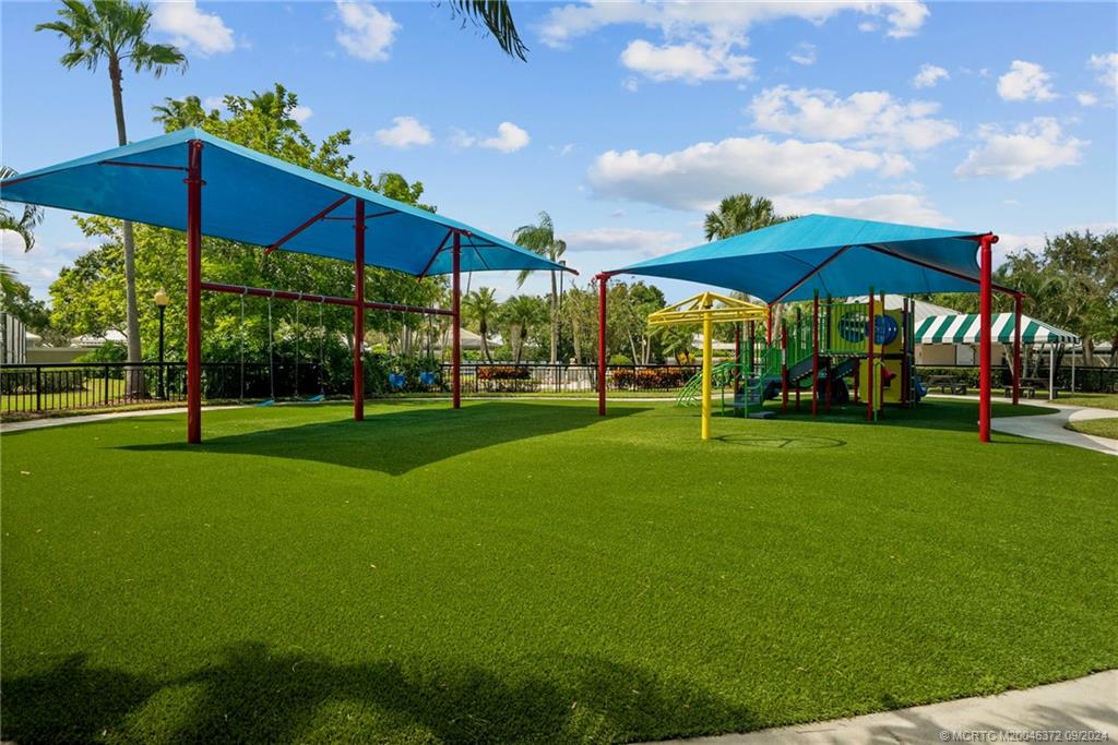 1663 Southwest Springfield Court Palm City, FL 34990 - Photo 27 of 27 a view of a park with large trees